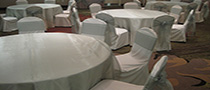 white chair cover with sage sash